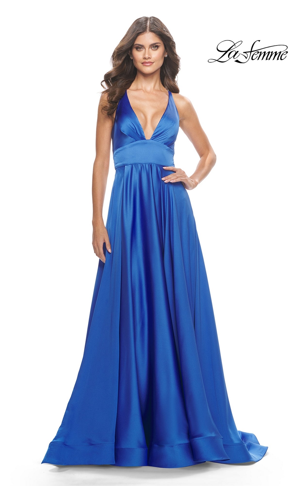 A woman wears the Deep V-Neck Long A-Line Prom Dress: La Femme 31533 in royal blue satin, featuring a sleeveless design and floor-length A-line silhouette, standing against a white background.